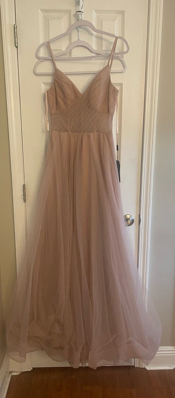 La Femme tulle A-line gown with pockets. Bodice features a sheer design. A29.